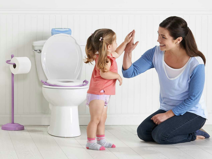 baby and mother near toilet