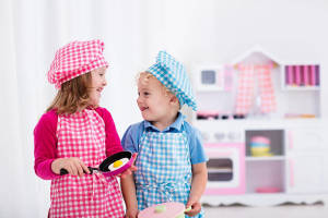 kids in toy kitchen 